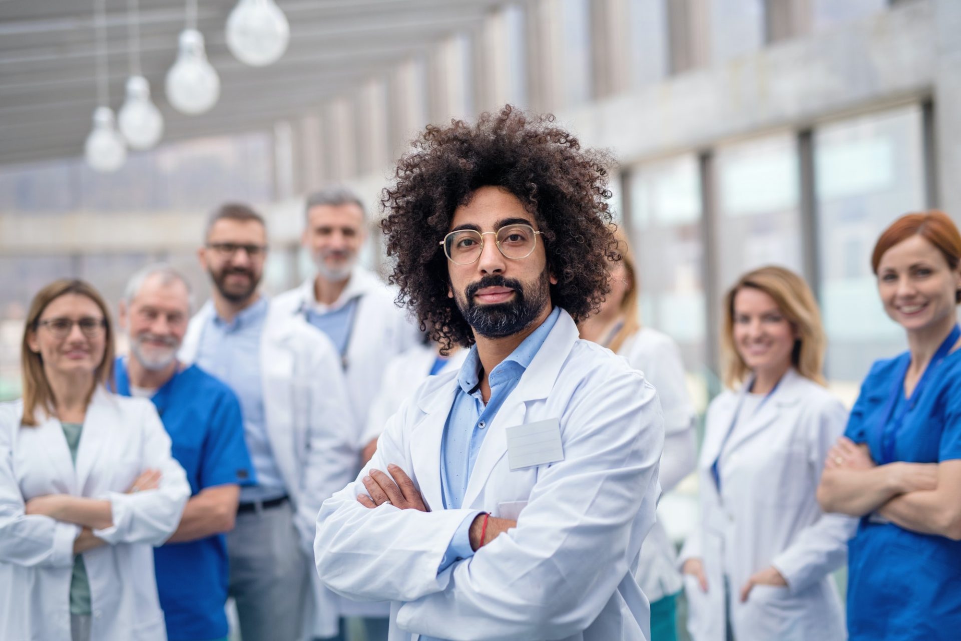 group-of-doctors-standing-in-corridor-on-medical-conference-e1623252293962.jpg